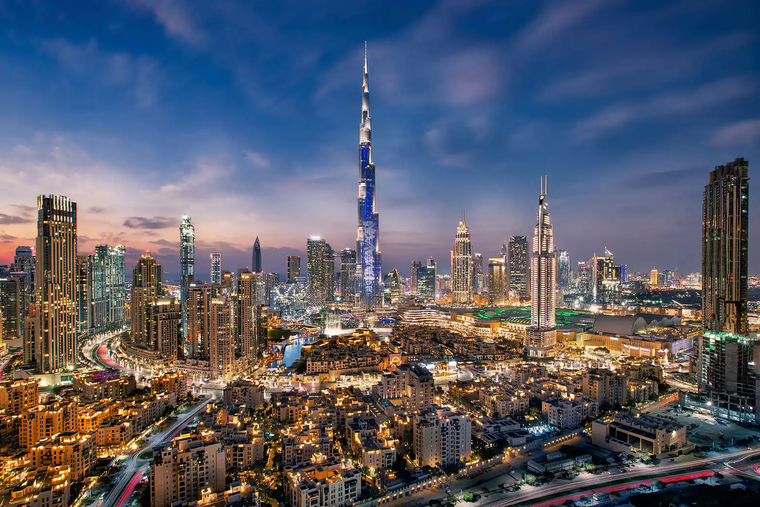 "Burj Khalifa during a thunderstorm with lightning striking the spire, highlighting its lightning conductor system."