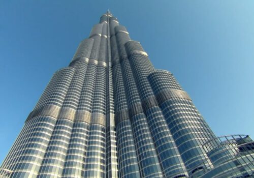 The Burj Khalifa towering above the Dubai skyline during sunrise.