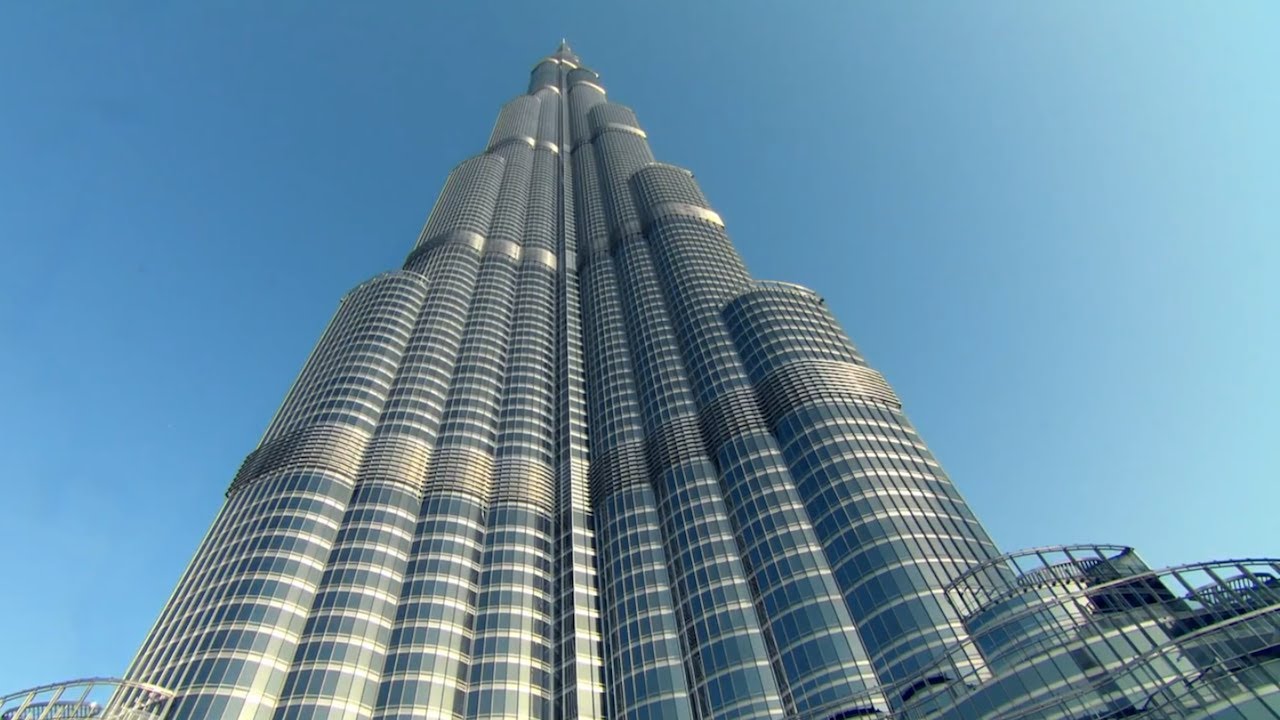 The Burj Khalifa towering above the Dubai skyline during sunrise.